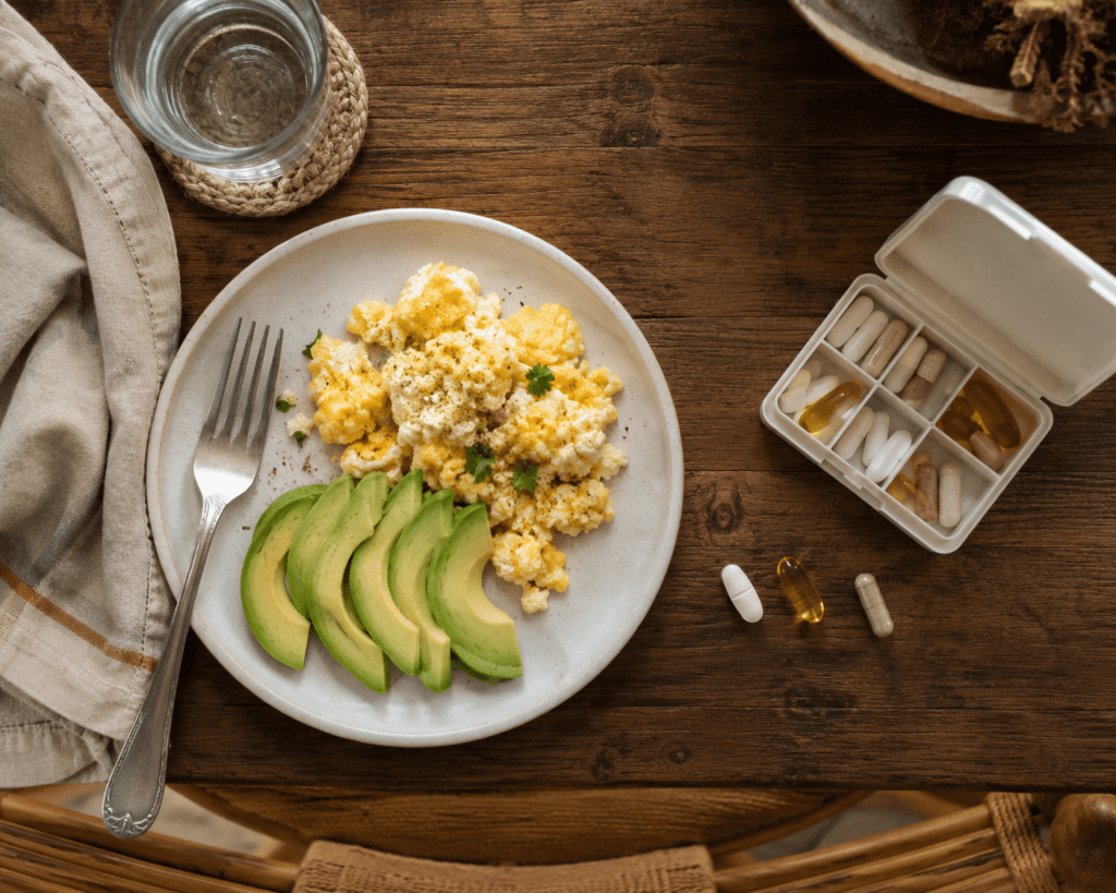 Supplement routine with magnesium and berberine capsules arranged beside breakfast meal
